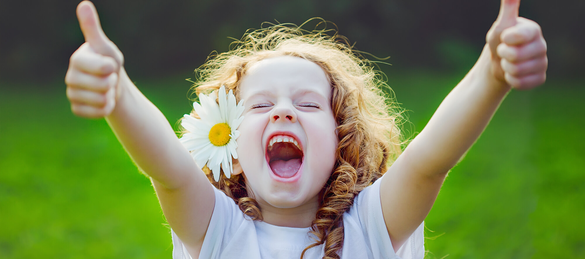 girl with arms raised - Pediatric Dentist in Portage, MI